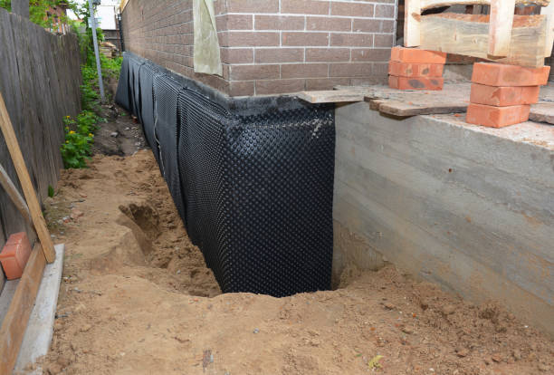 Happy homeowners after waterproofing job in Doylestown